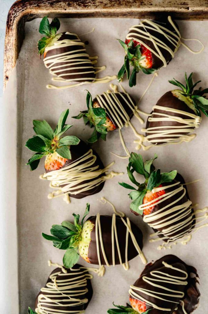 A tray of decadent Chocolate Covered Strawberries, each berry dipped in smooth chocolate for a deliciously elegant treat.