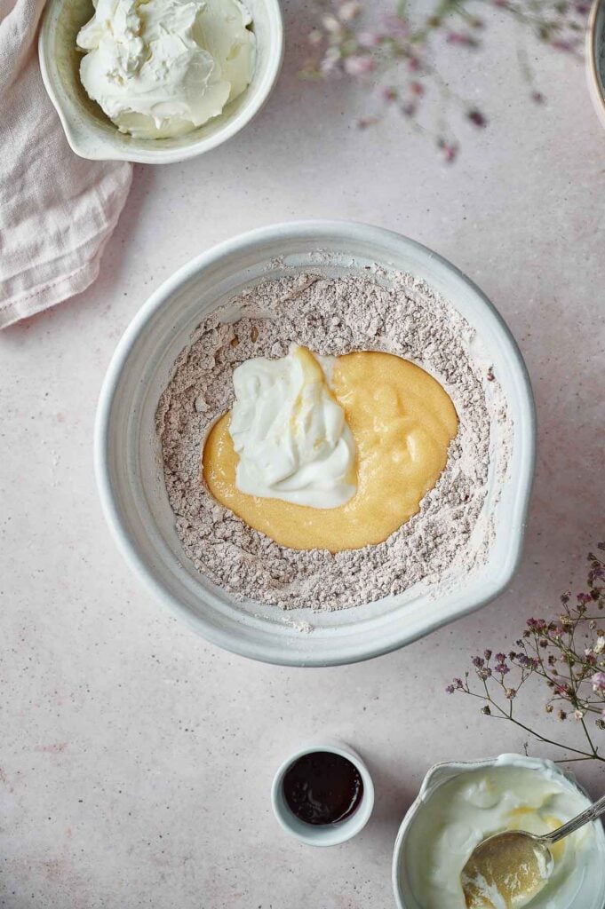 Red velvet cake process shot of dry ingredients and a buttermilk well before alternating it into the batter.