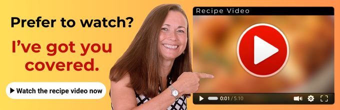 Smiling woman points at a video player screen with a large play button and the text "Prefer to watch? I've got you covered. Watch the recipe video now.
