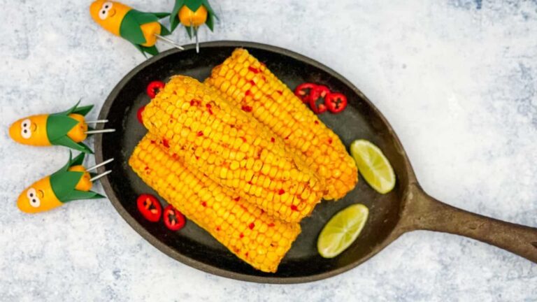 Three chili and lime corns on a skillet.
